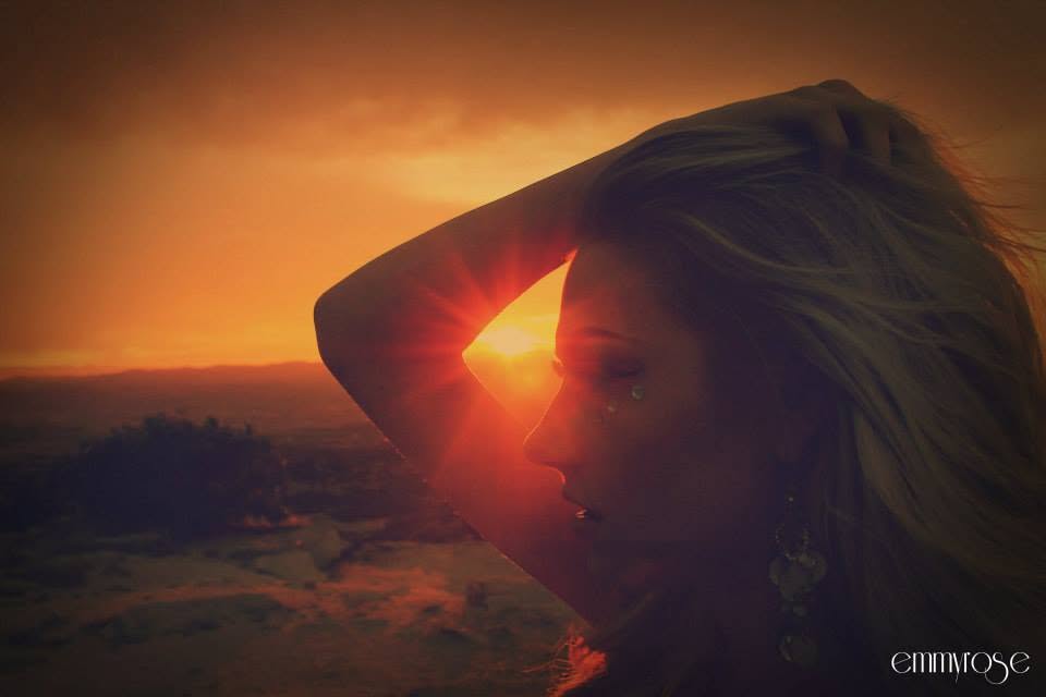 Artistic model silhouette in orange sunset light